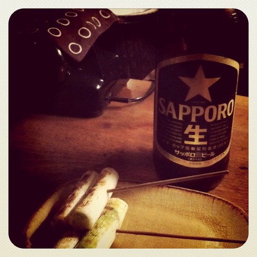 beer,phone,grilled Japanese leek